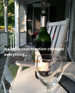Wine glass and bottle on a quiet porch table at sunset, symbolizing reflection and a conversation that sparked a marketing insight.